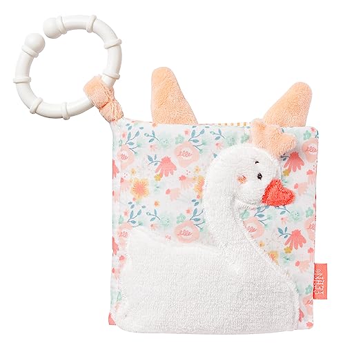 Miękka książeczka Fehn Schwanensee z białym łabędziem na kwiecistej okładce i białym pierścieniem.