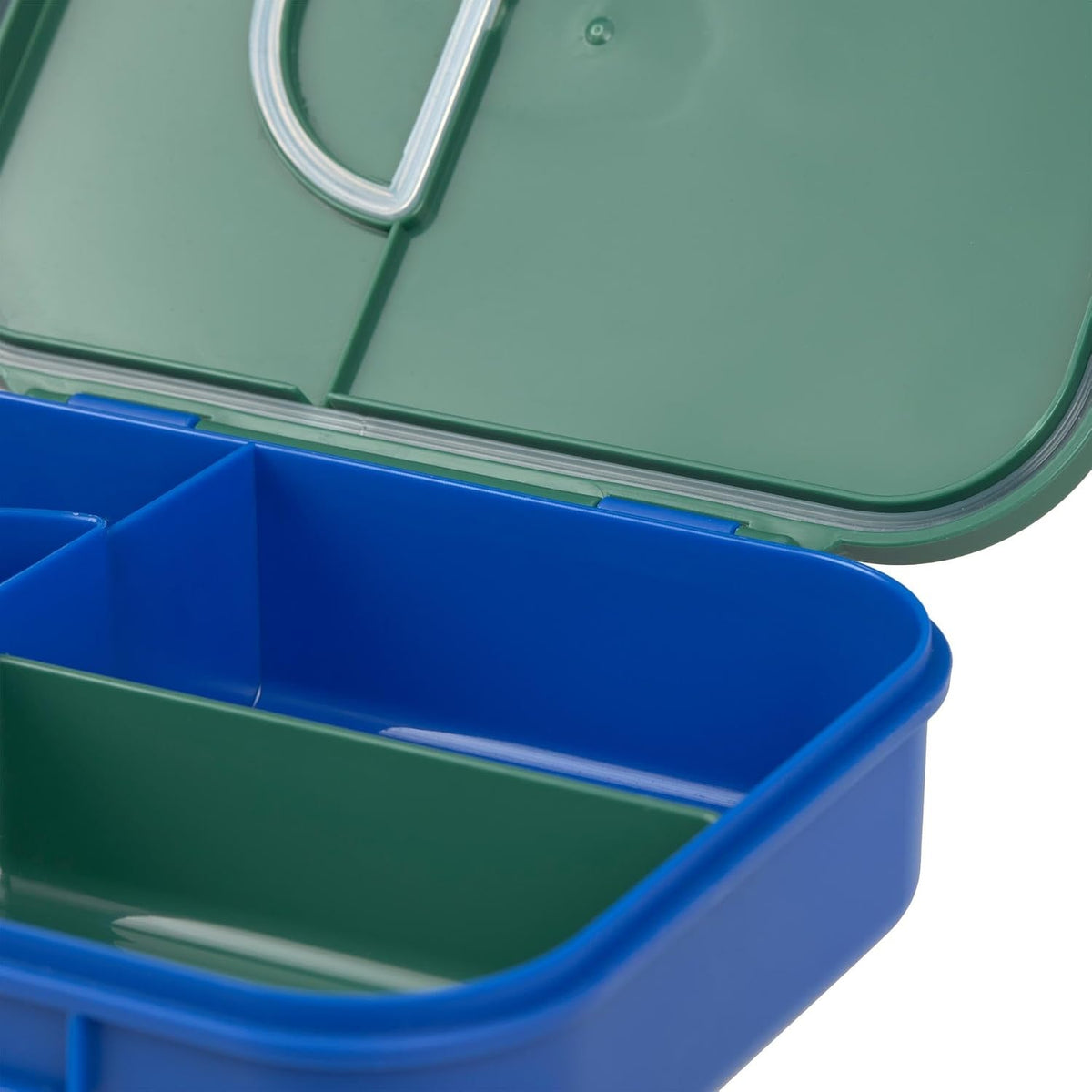 Wnętrze śniadaniówki Lässig Bento Tęcza oraz spód zielonej pokrywki z widoczną uszczelką.