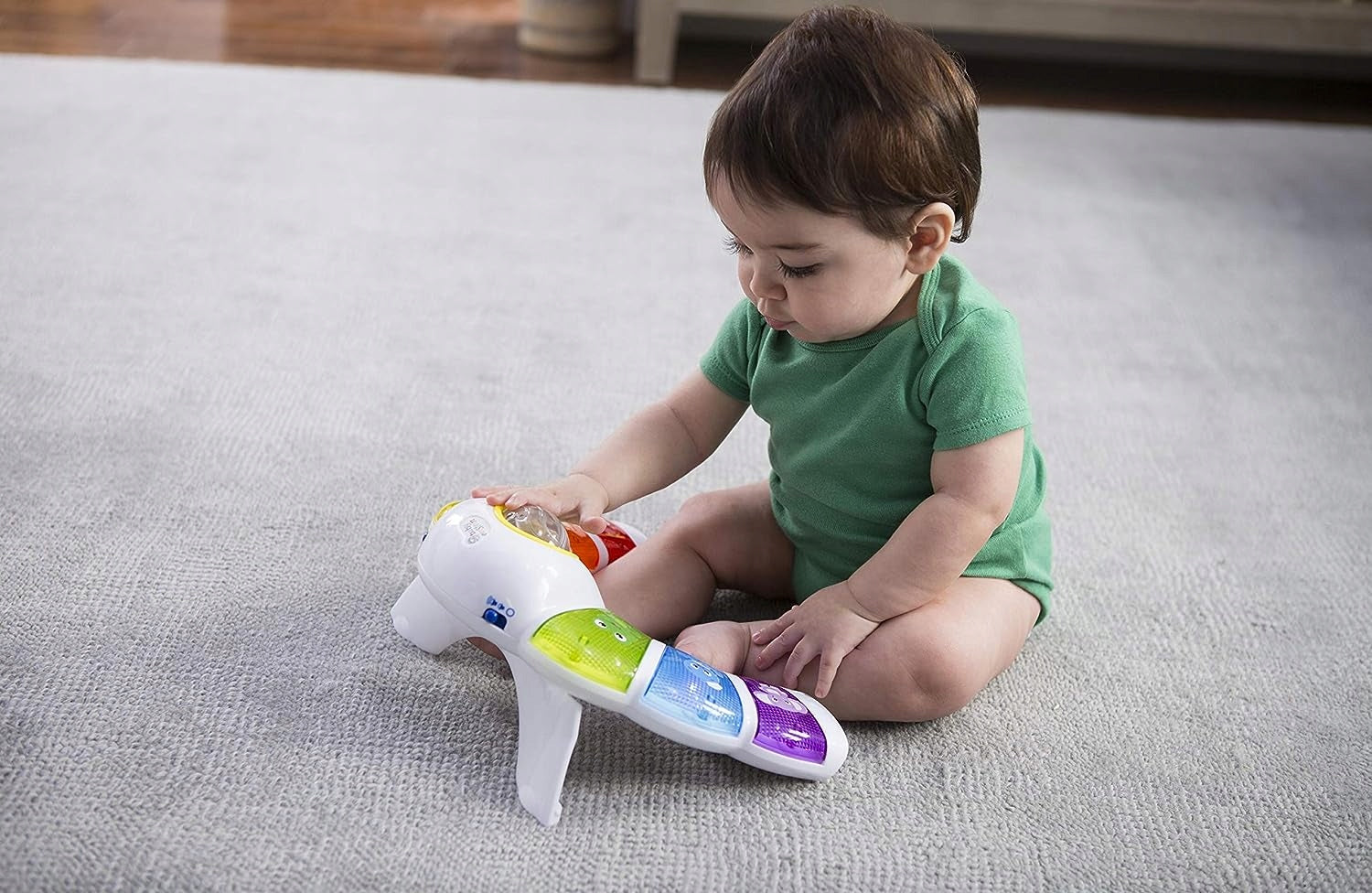 BABY EINSTEIN panel świetlny z grzechotką, melodiami i słowami w 3 językach