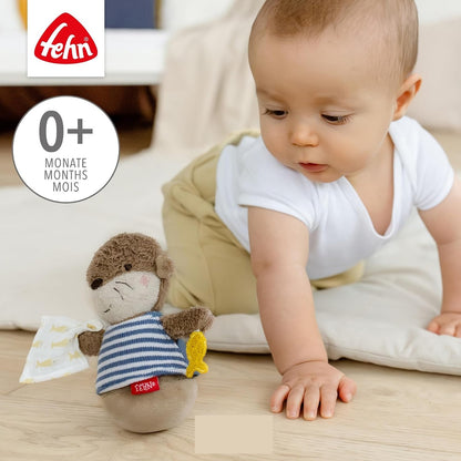 FEHN Otter roly-poly toy with a rattle, 15 cm